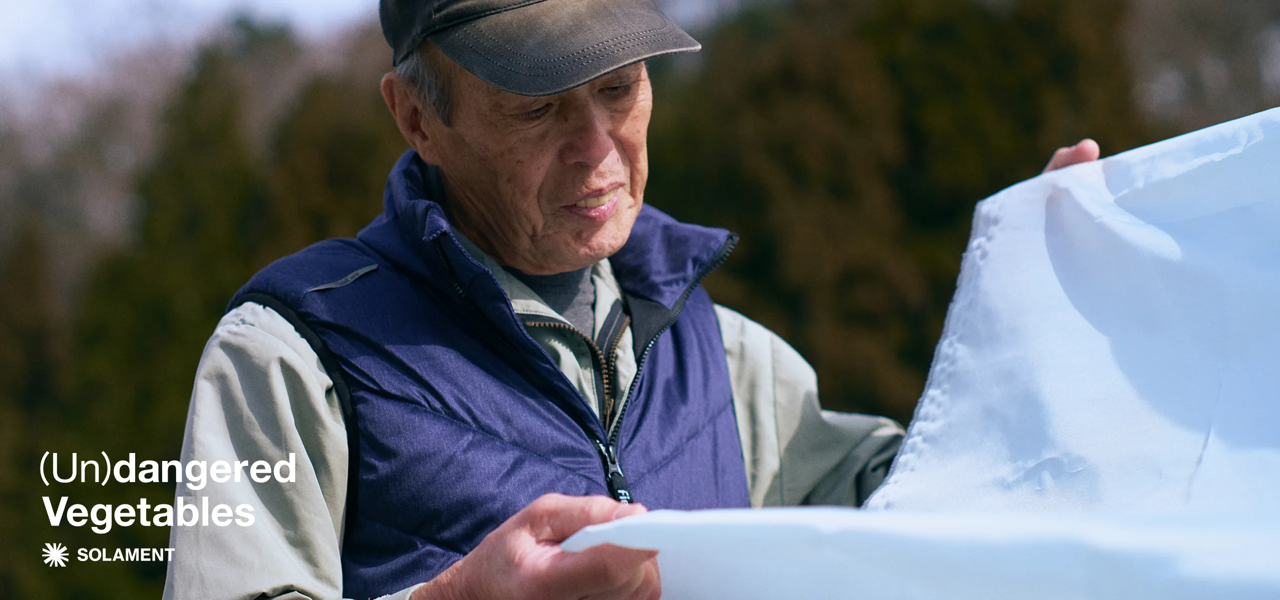 A farmer working with heat-shielding materials made with SOLAMENT™