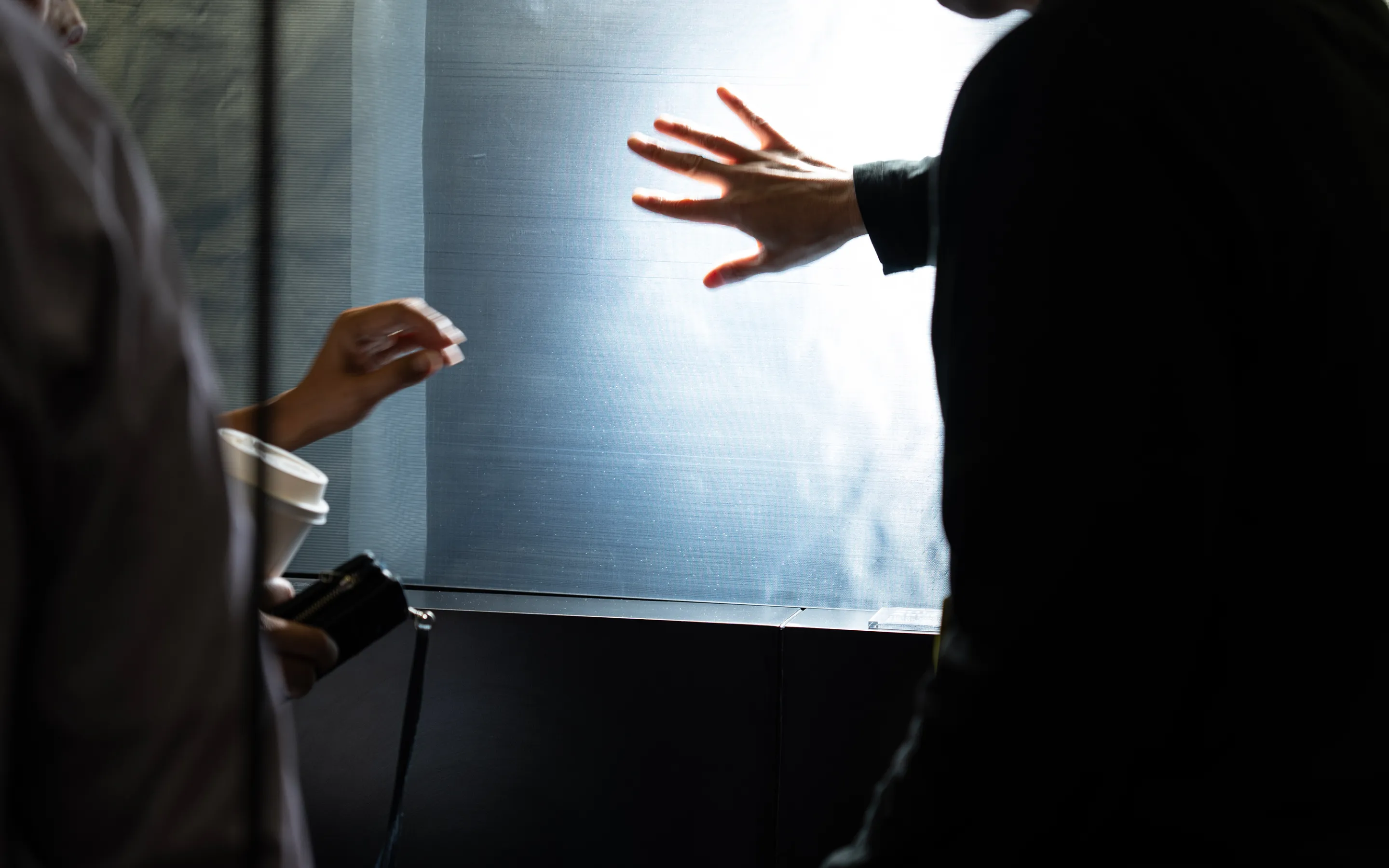 A visual from SXSW 2025. A visual of visitors examining the material