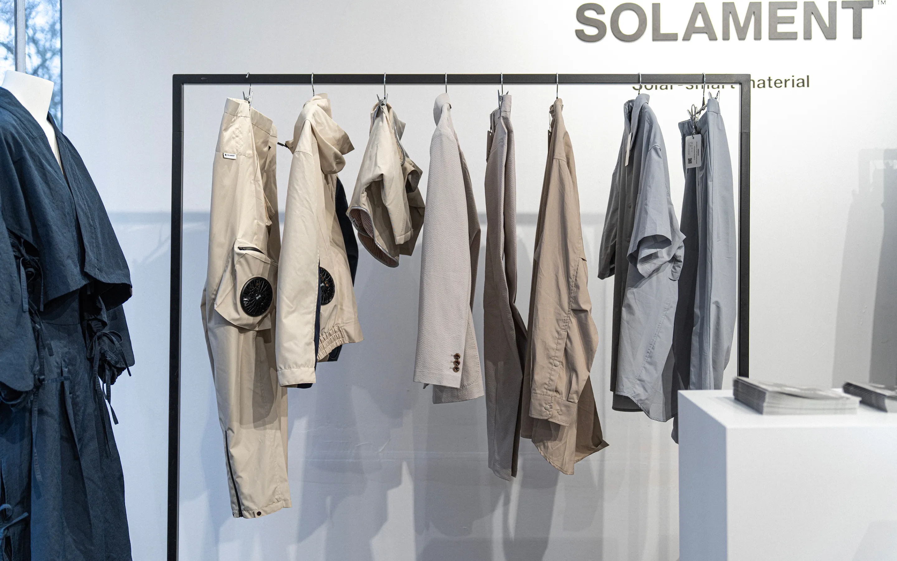 A visual from an exhibition in Paris showcasing multiple pieces centered around HOPE WEAR