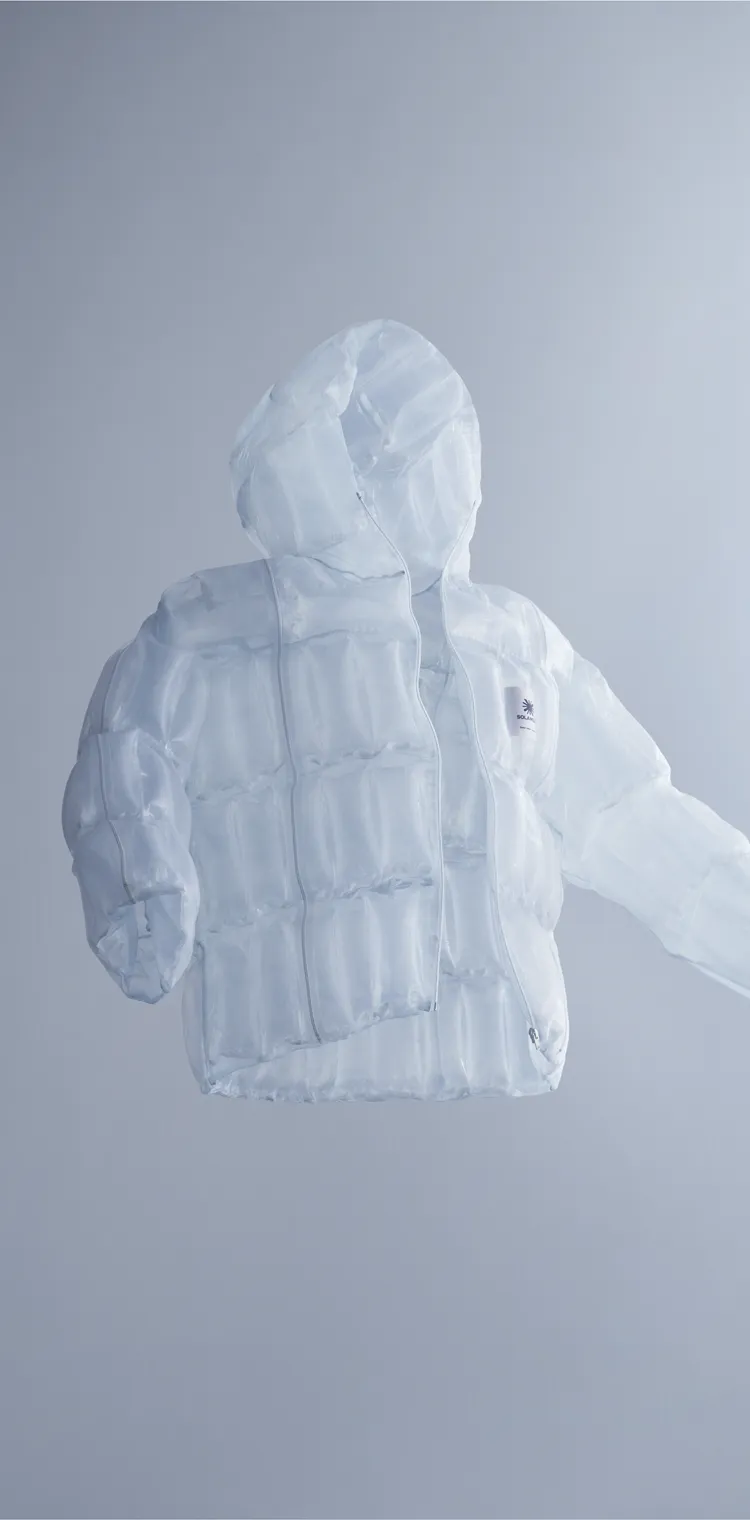 A jacket made with the transparent material that generates heat from sunlight, floating in mid-air, evoking zero-gravity lightness and the brand’s innovative spirit