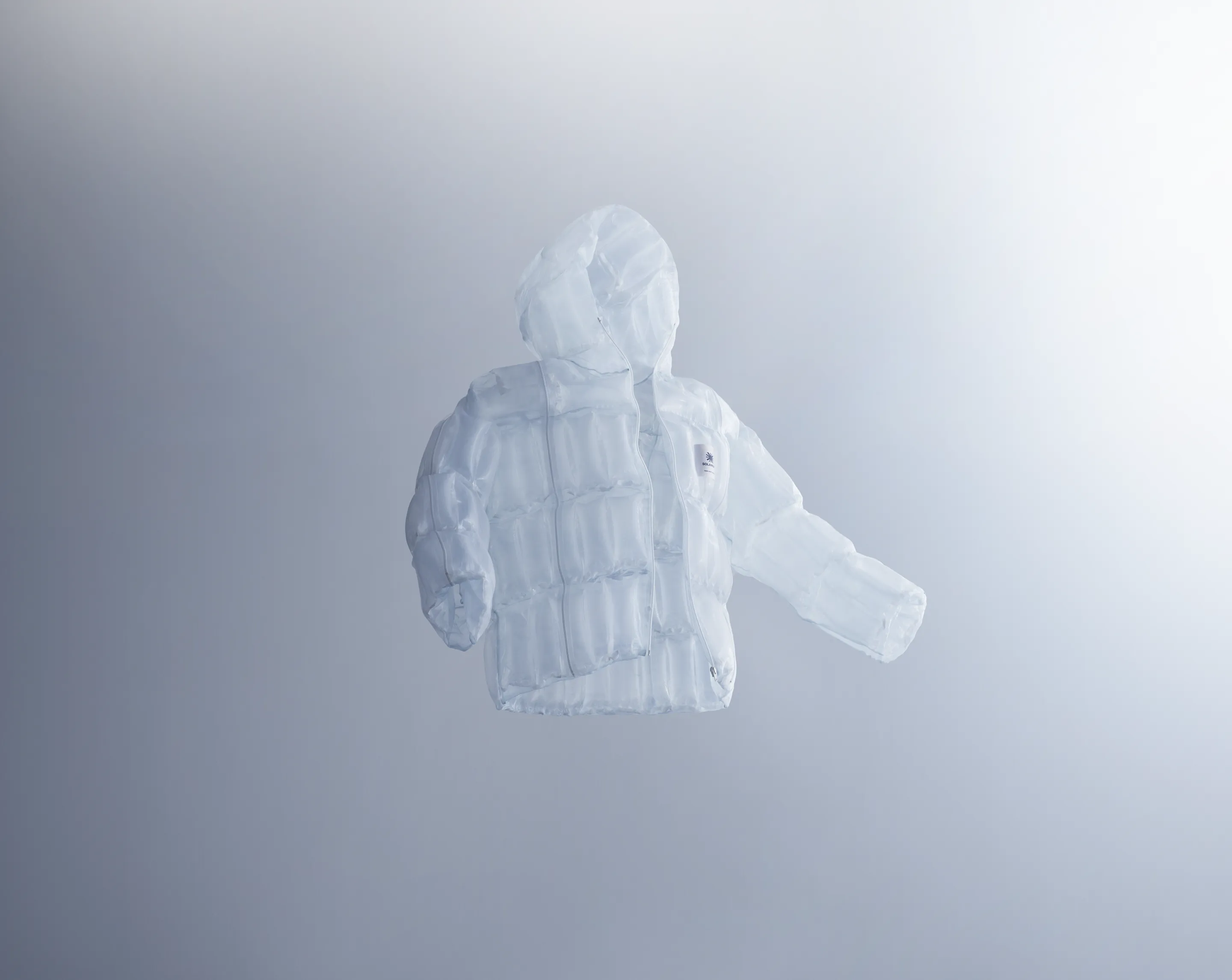 A jacket made with the transparent material that generates heat from sunlight, floating in mid-air, evoking zero-gravity lightness and the brand’s innovative spirit