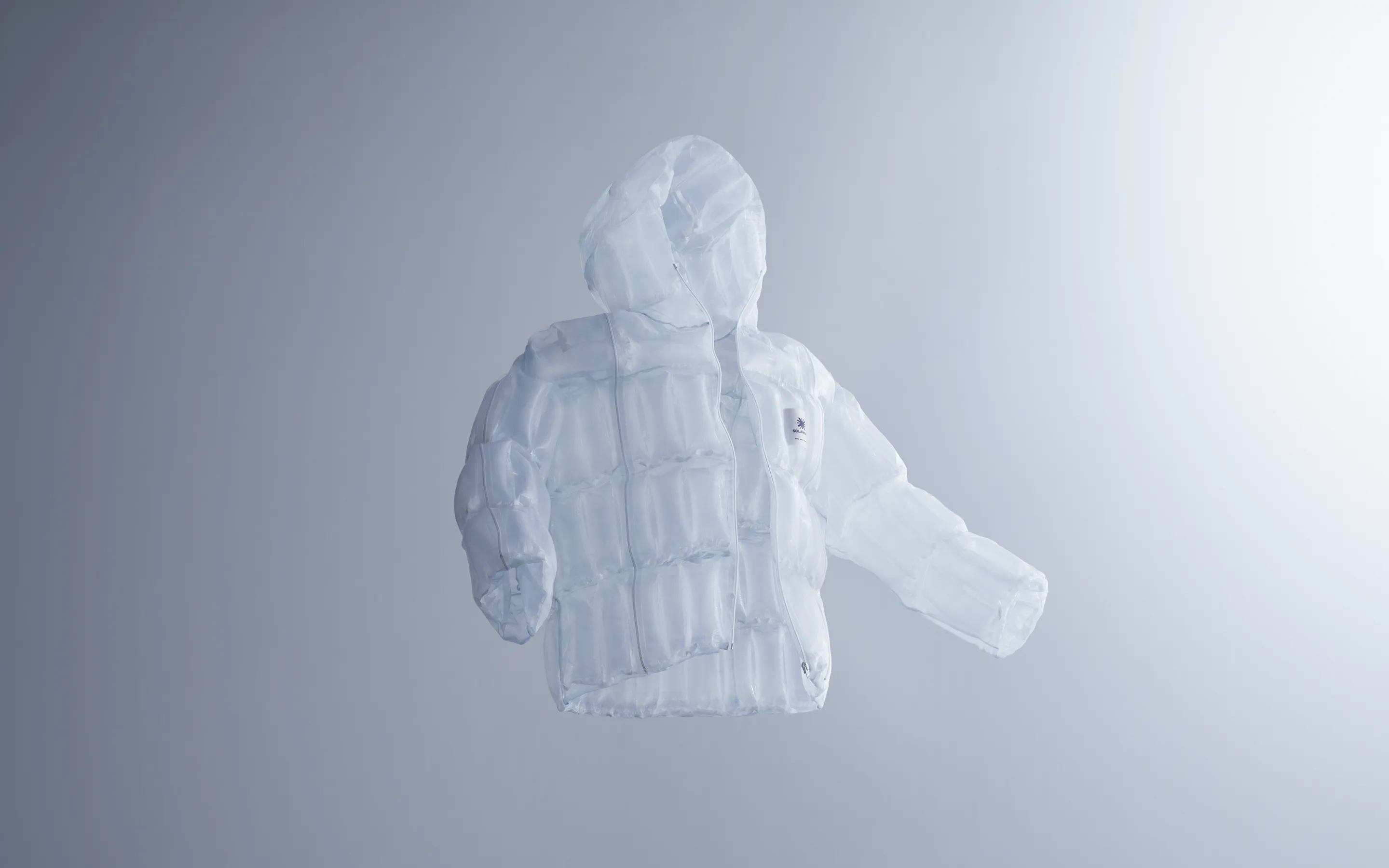 A jacket made with the transparent material that generates heat from sunlight, floating in mid-air, evoking zero-gravity lightness and the brand’s innovative spirit